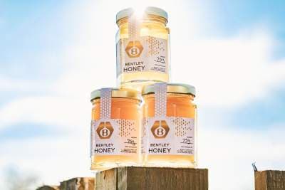 Bentley's Flying Bees have broken a milestone by producing more than 1,000 jars of honey